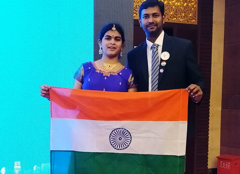 Indian memory athletes holding the Indian flag at an international memory championship