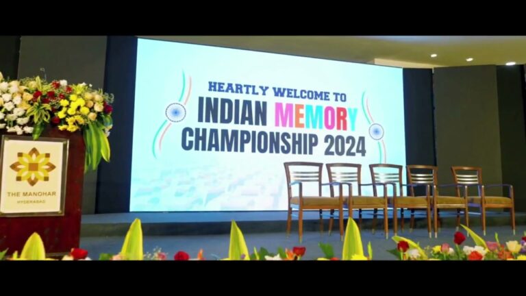 Stage at the Indian Memory Championship, with the welcome banner and seating for finalists